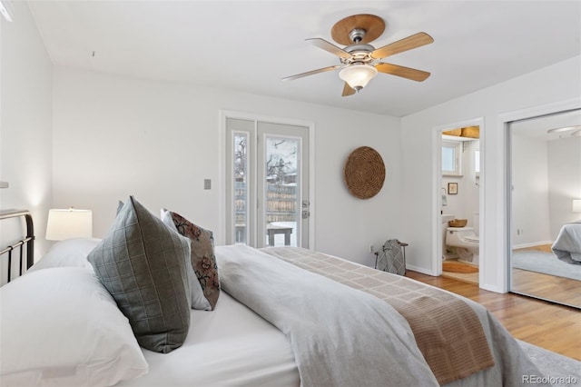 bedroom with baseboards, a ceiling fan, connected bathroom, wood finished floors, and access to outside