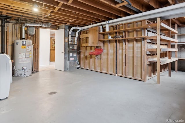 unfinished basement featuring heating unit and water heater