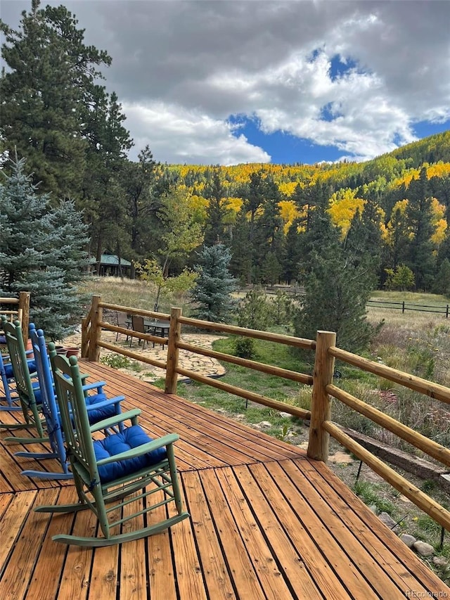 179 Elk Meadow Run, Antonito, CO 81120 - wooden deck featuring a wooded view