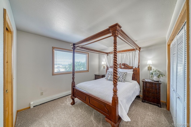 895 Acorn Rd, Cotopaxi, CO 81223 - bedroom with a baseboard heating unit and carpet floors
