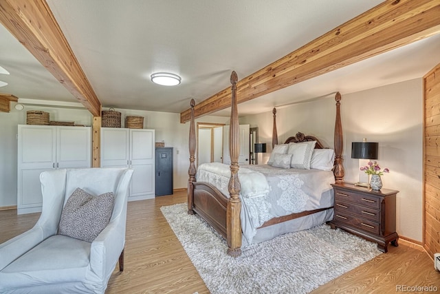 895 Acorn Rd, Cotopaxi, CO 81223 - bedroom featuring light wood-style flooring and beamed ceiling