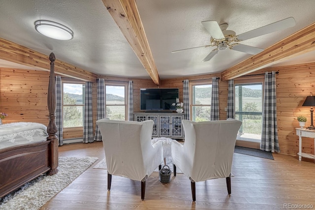 895 Acorn Rd, Cotopaxi, CO 81223 - bedroom with a textured ceiling, wooden walls, and wood finished floors