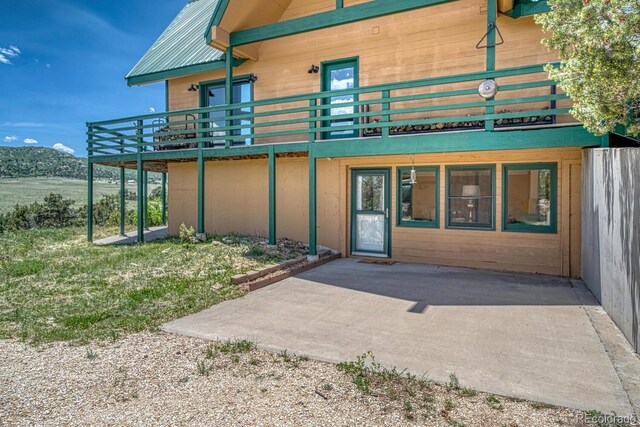 895 Acorn Rd, Cotopaxi, CO 81223 - property entrance featuring a patio area and a metal roof
