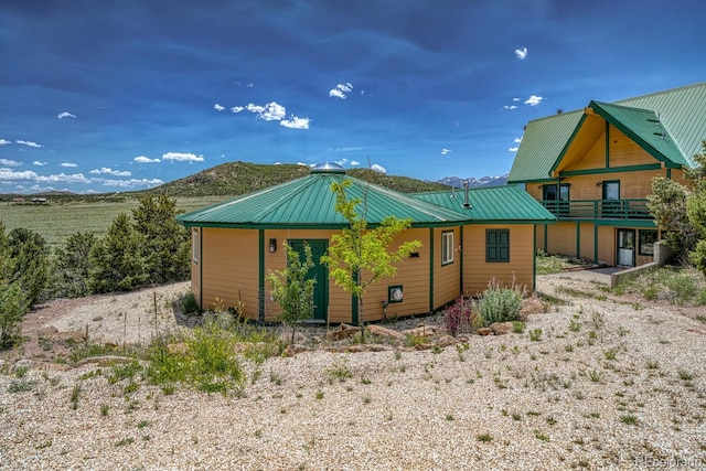 895 Acorn Rd, Cotopaxi, CO 81223 - back of property featuring a metal roof, a standing seam roof, and a mountain view
