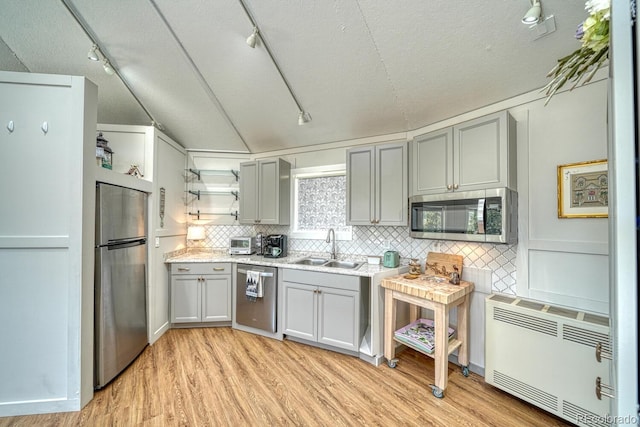 895 Acorn Rd, Cotopaxi, CO 81223 - kitchen with appliances with stainless steel finishes, track lighting, open shelves, gray cabinetry, and backsplash