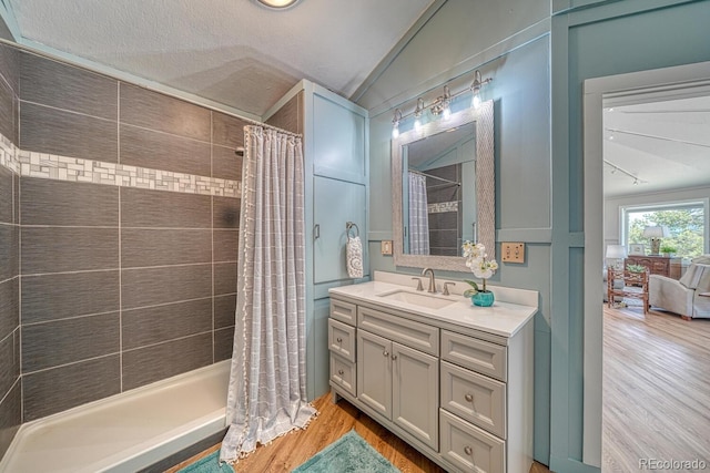 895 Acorn Rd, Cotopaxi, CO 81223 - full bath featuring lofted ceiling, wood finished floors, vanity, and a tile shower