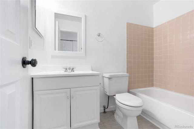 bathroom with toilet, washtub / shower combination, and vanity