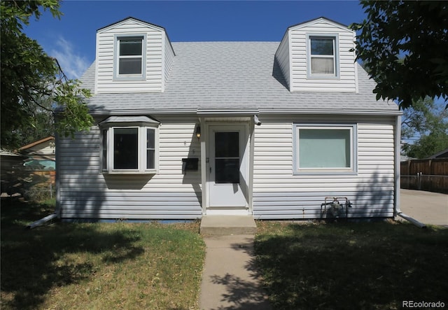 875 Kenton St, Aurora, CO 80010 - cape cod home featuring a shingled roof