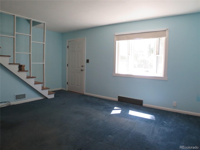 875 Kenton St, Aurora, CO 80010 - entryway featuring carpet and stairway