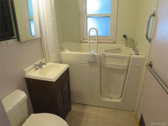 875 Kenton St, Aurora, CO 80010 - bathroom with tile patterned flooring, vanity, a tub, and a shower with shower curtain