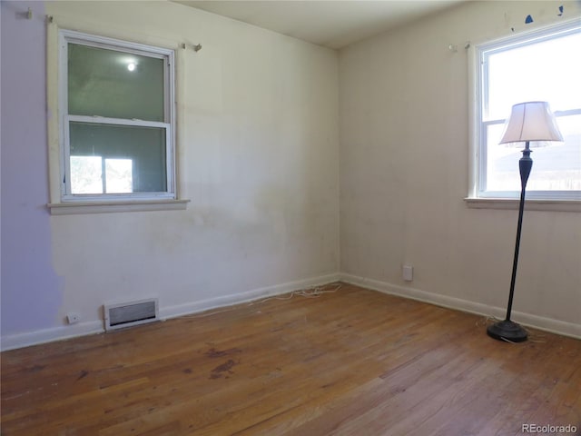 875 Kenton St, Aurora, CO 80010 - empty room featuring wood finished floors and baseboards