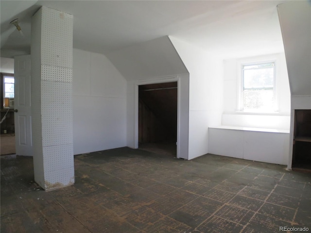 875 Kenton St, Aurora, CO 80010 - additional living space featuring healthy amount of natural light and lofted ceiling