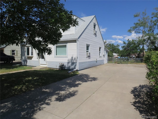 875 Kenton St, Aurora, CO 80010 - view of property exterior with concrete driveway and a shingled roof