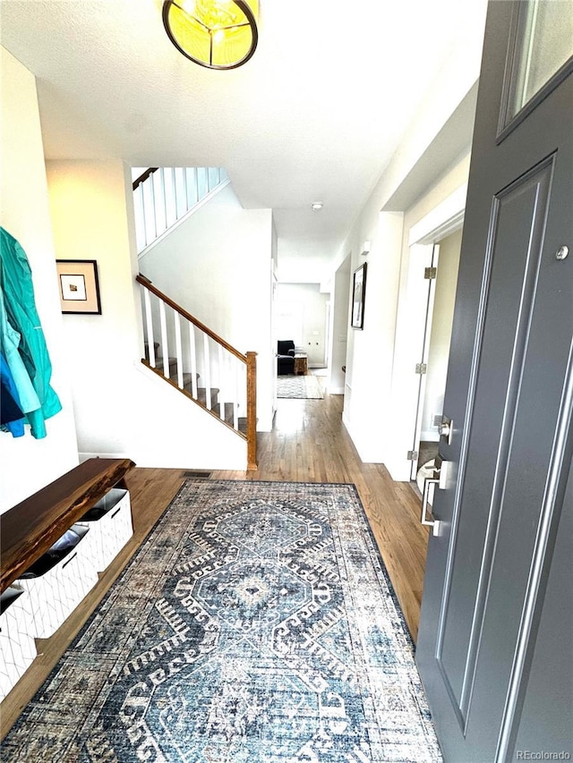 2831 Shadow Lake Rd, Lafayette, CO 80026 - foyer entrance featuring wood finished floors, stairs, and baseboards