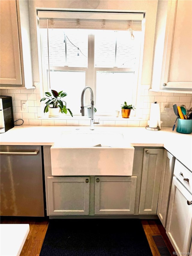 2831 Shadow Lake Rd, Lafayette, CO 80026 - kitchen with stainless steel dishwasher, a sink, healthy amount of natural light, and light countertops