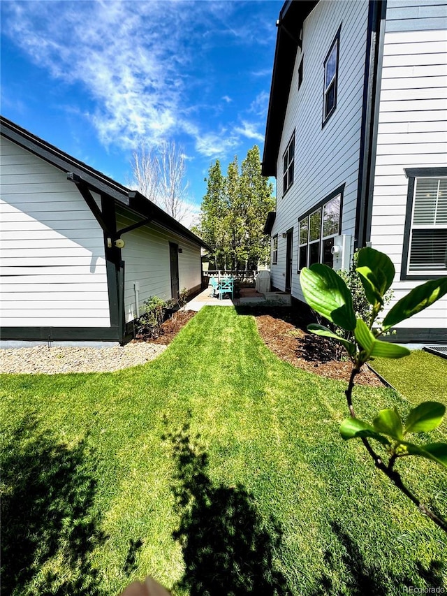 2831 Shadow Lake Rd, Lafayette, CO 80026 - view of grassy yard featuring a patio