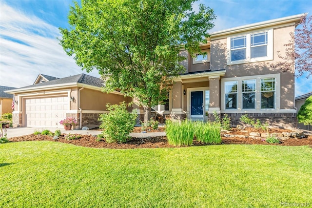 view of front facade with a garage and a front yard