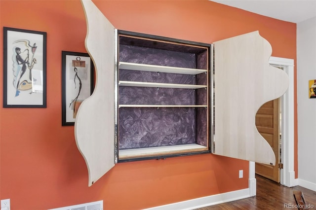 details featuring baseboards and wood finished floors