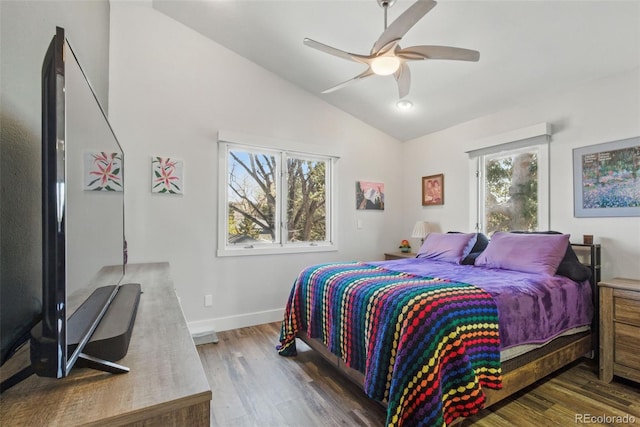 bedroom featuring ceiling fan, baseboards, vaulted ceiling, and wood finished floors