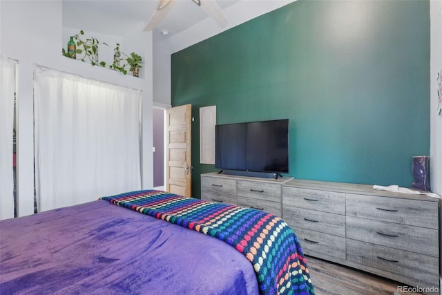 bedroom featuring wood finished floors and a ceiling fan
