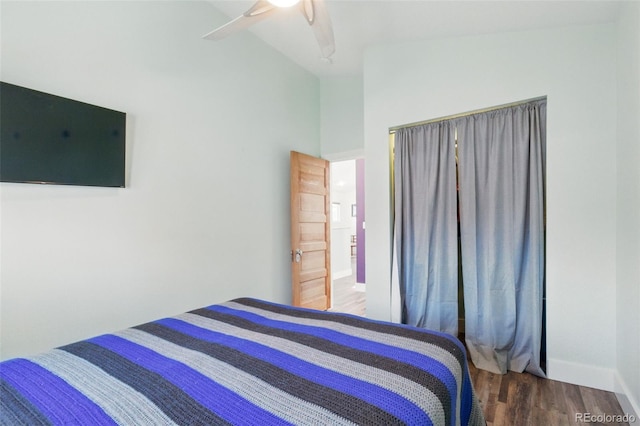bedroom featuring baseboards, a ceiling fan, high vaulted ceiling, and wood finished floors