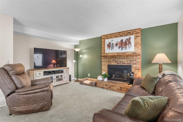 living room with carpet flooring, a fireplace, a textured ceiling, and baseboards