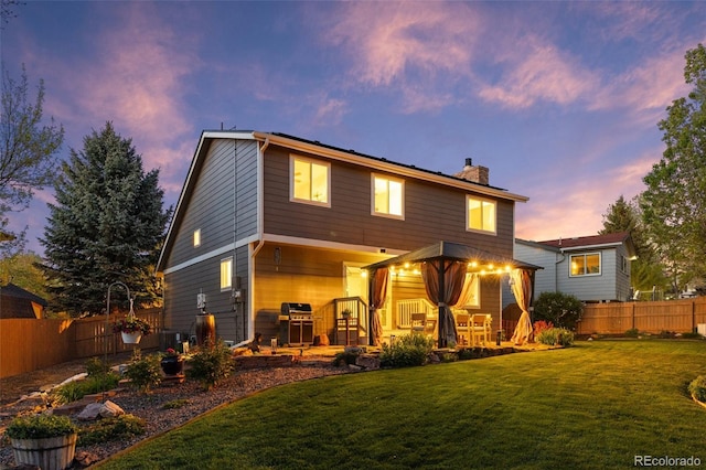 rear view of property featuring a chimney, a patio area, and central air condition unit