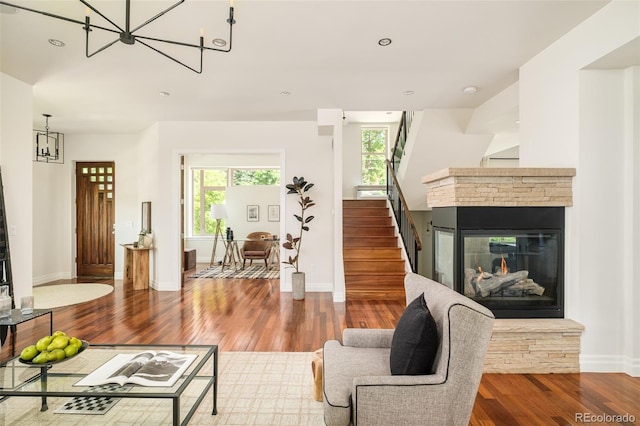 2990 Osceola St, Denver, CO 80212 - living room with a chandelier, stairs, wood finished floors, plenty of natural light, and recessed lighting