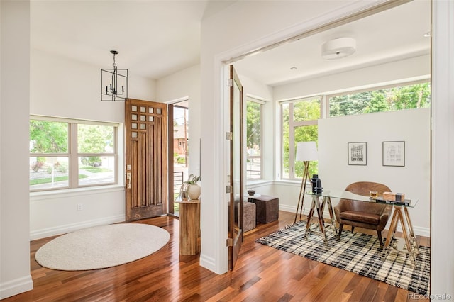 2990 Osceola St, Denver, CO 80212 - foyer entrance with wood finished floors, baseboards, and a chandelier
