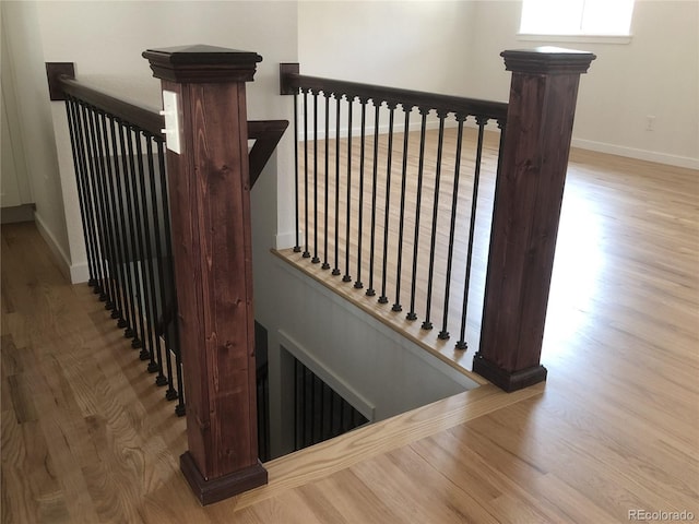 10751 W 66th Ave, Arvada, CO 80004 - staircase featuring baseboards and wood finished floors