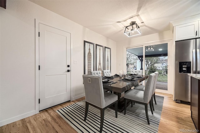 10751 W 66th Ave, Arvada, CO 80004 - dining space with light wood-type flooring and baseboards