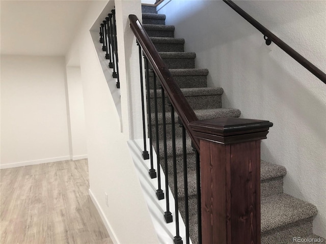 10751 W 66th Ave, Arvada, CO 80004 - stairway with baseboards and wood finished floors