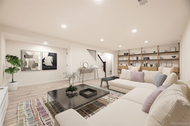 10751 W 66th Ave, Arvada, CO 80004 - living area featuring visible vents, stairs, baseboards, light wood-style floors, and recessed lighting