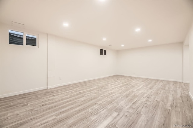 10751 W 66th Ave, Arvada, CO 80004 - finished basement featuring baseboards, recessed lighting, and light wood-style flooring