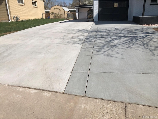 10751 W 66th Ave, Arvada, CO 80004 - exterior details featuring concrete driveway and fence