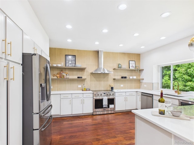 3957 S Peach Way, Denver, CO 80237 - kitchen featuring stainless steel appliances, wall chimney range hood, tasteful backsplash, open shelves, and recessed lighting