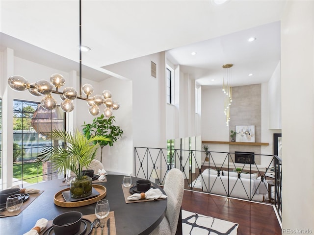 3957 S Peach Way, Denver, CO 80237 - dining room featuring wood finished floors, a chandelier, and recessed lighting