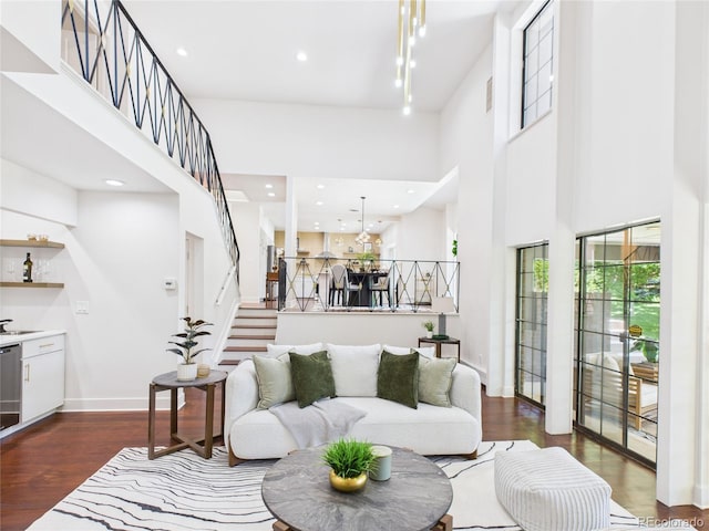 3957 S Peach Way, Denver, CO 80237 - living area featuring a high ceiling, dark wood finished floors, stairs, and recessed lighting