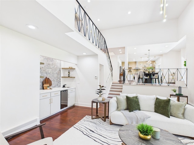 3957 S Peach Way, Denver, CO 80237 - living room with dark wood-type flooring, recessed lighting, stairs, and beverage cooler