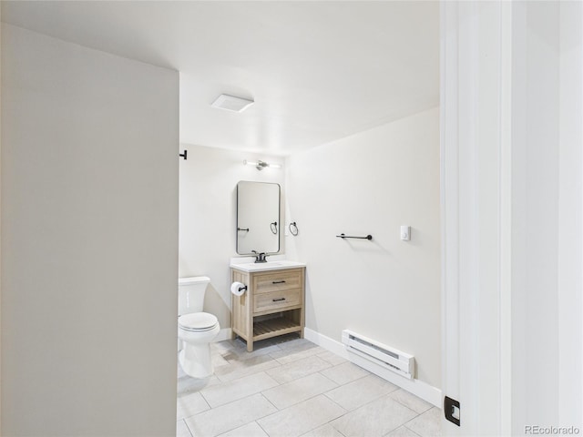 3957 S Peach Way, Denver, CO 80237 - bathroom with a baseboard radiator, vanity, and tile patterned floors