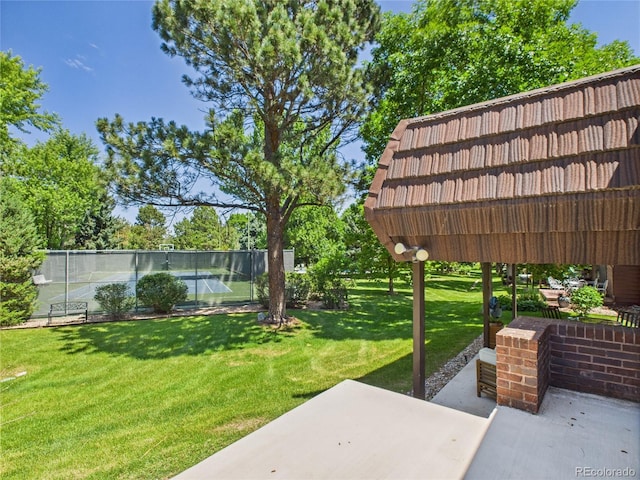 3957 S Peach Way, Denver, CO 80237 - view of yard featuring a tennis court and a patio