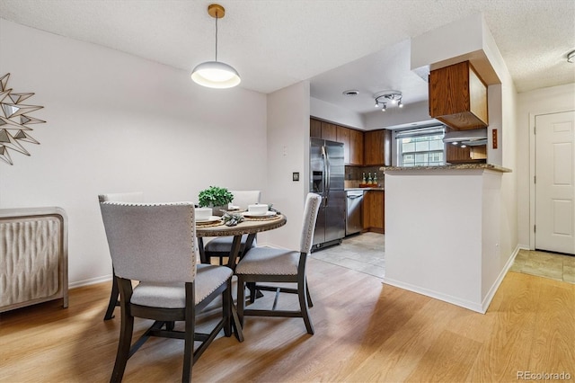 2710 E Otero Pl Unit 6, Centennial, CO 80122 - dining room featuring light wood-type flooring