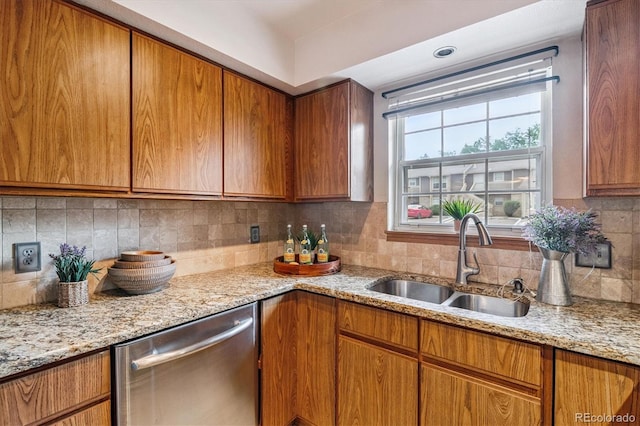 2710 E Otero Pl Unit 6, Centennial, CO 80122 - kitchen featuring stainless steel dishwasher, brown cabinets, and tasteful backsplash