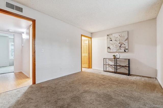 2710 E Otero Pl Unit 6, Centennial, CO 80122 - unfurnished room with carpet floors and a textured ceiling