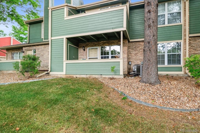 2710 E Otero Pl Unit 6, Centennial, CO 80122 - view of front of property featuring brick siding and a front lawn