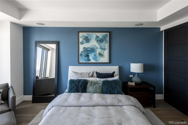 bedroom featuring wood-type flooring