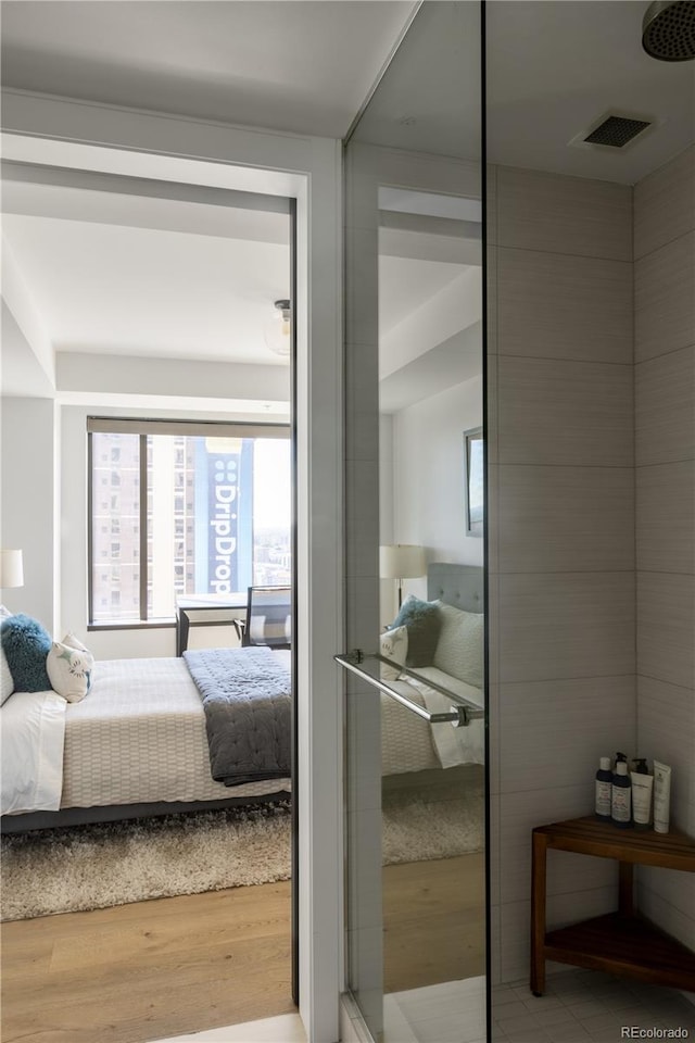 bedroom with wood-type flooring