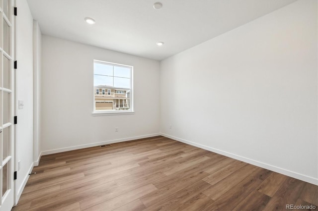 24748 E 40th Ave, Aurora, CO 80019 - empty room with light wood-type flooring, baseboards, and recessed lighting