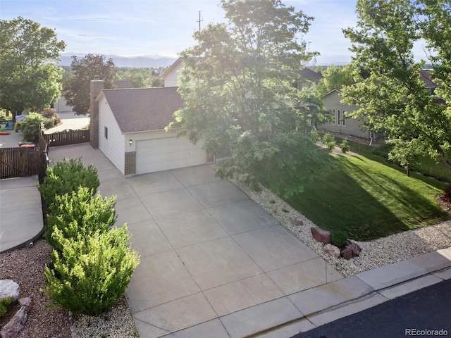 874 Mercury Cir, Lone Tree, CO 80124 - view of property hidden behind natural elements with driveway, an attached garage, a chimney, and roof with shingles