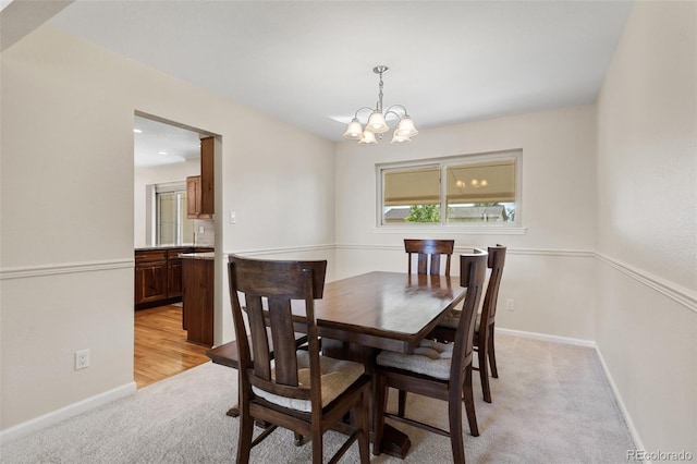 874 Mercury Cir, Lone Tree, CO 80124 - dining space with light carpet and a chandelier